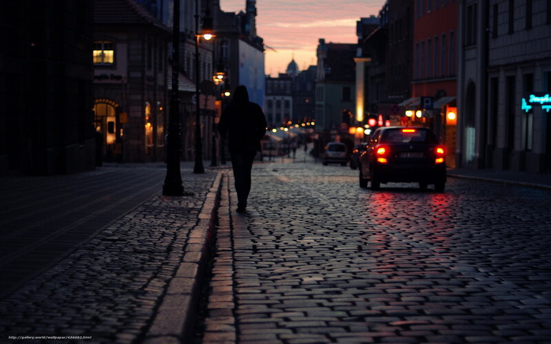 Person Walking on Cobblestone