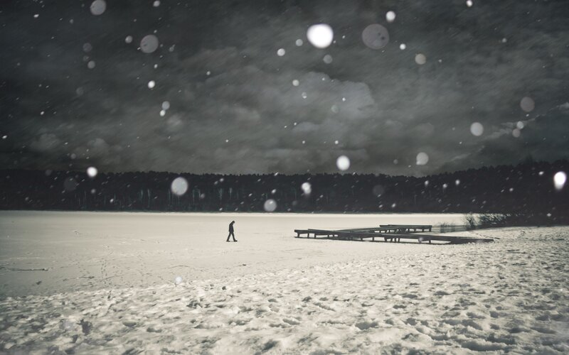 Person walking on frozen lake