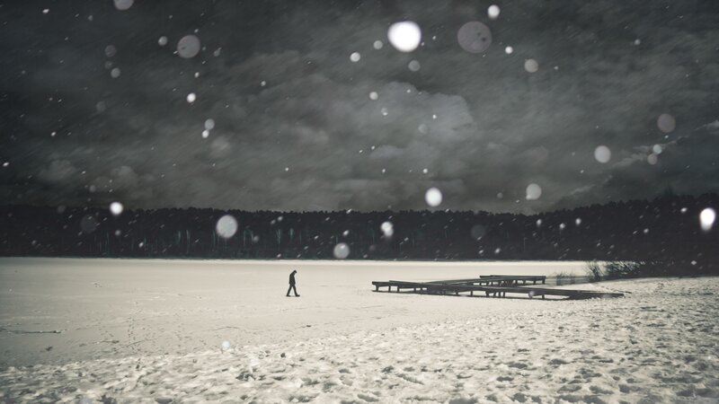 Person walking on frozen lake