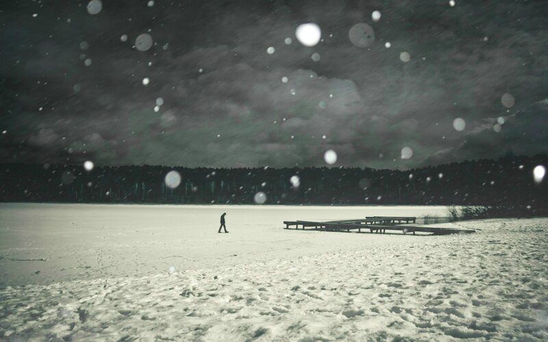 Person walking on frozen lake