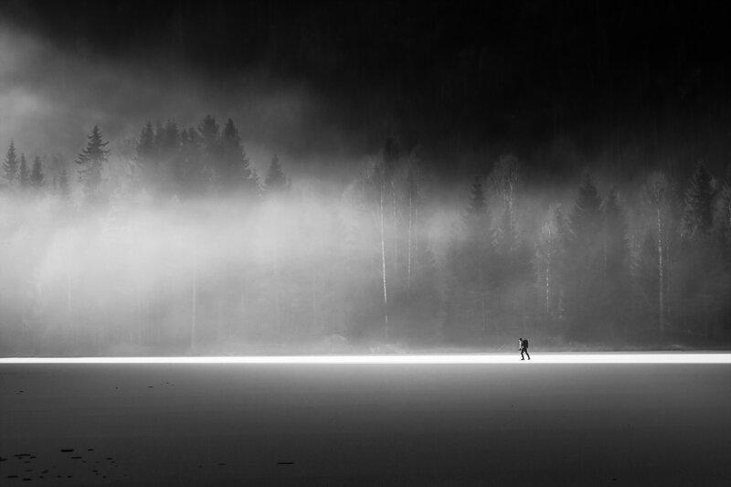 Person Walking on Frozen Lake — Black