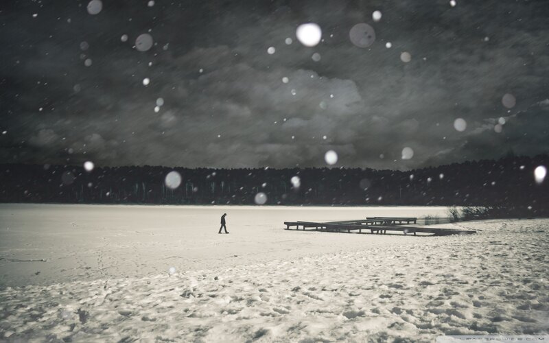 Person Walking on Frozen Lake — White