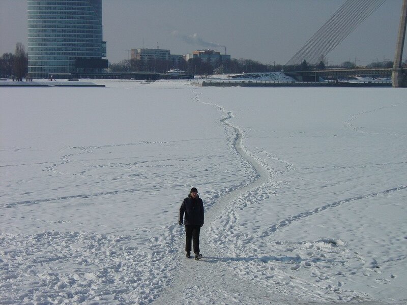 Person walking on frozen river