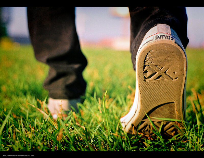 person walking on grass