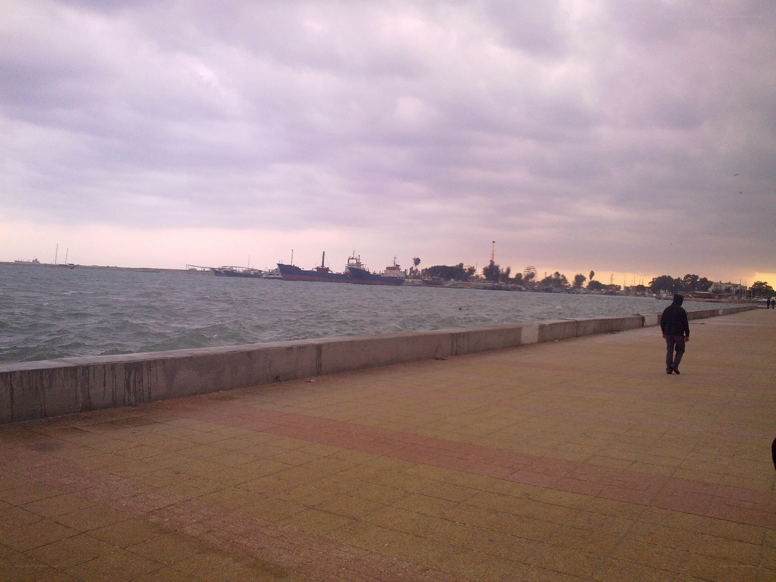 person walking on pier