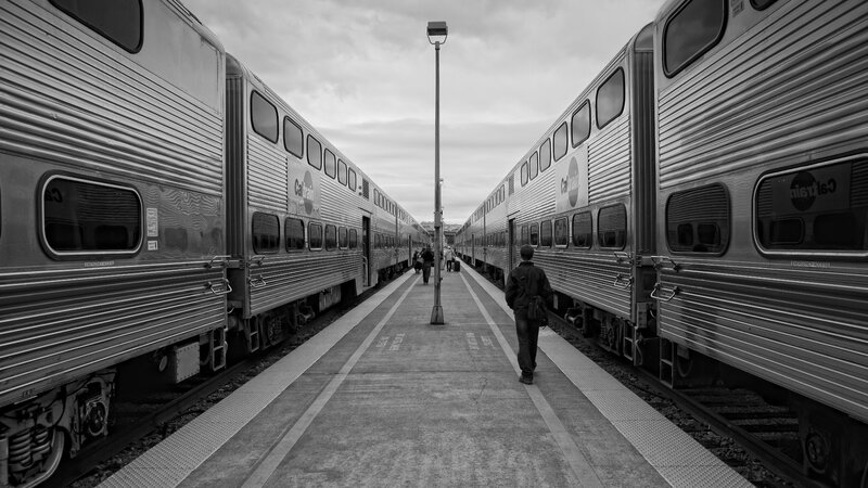 Person Walking on Platform — Black