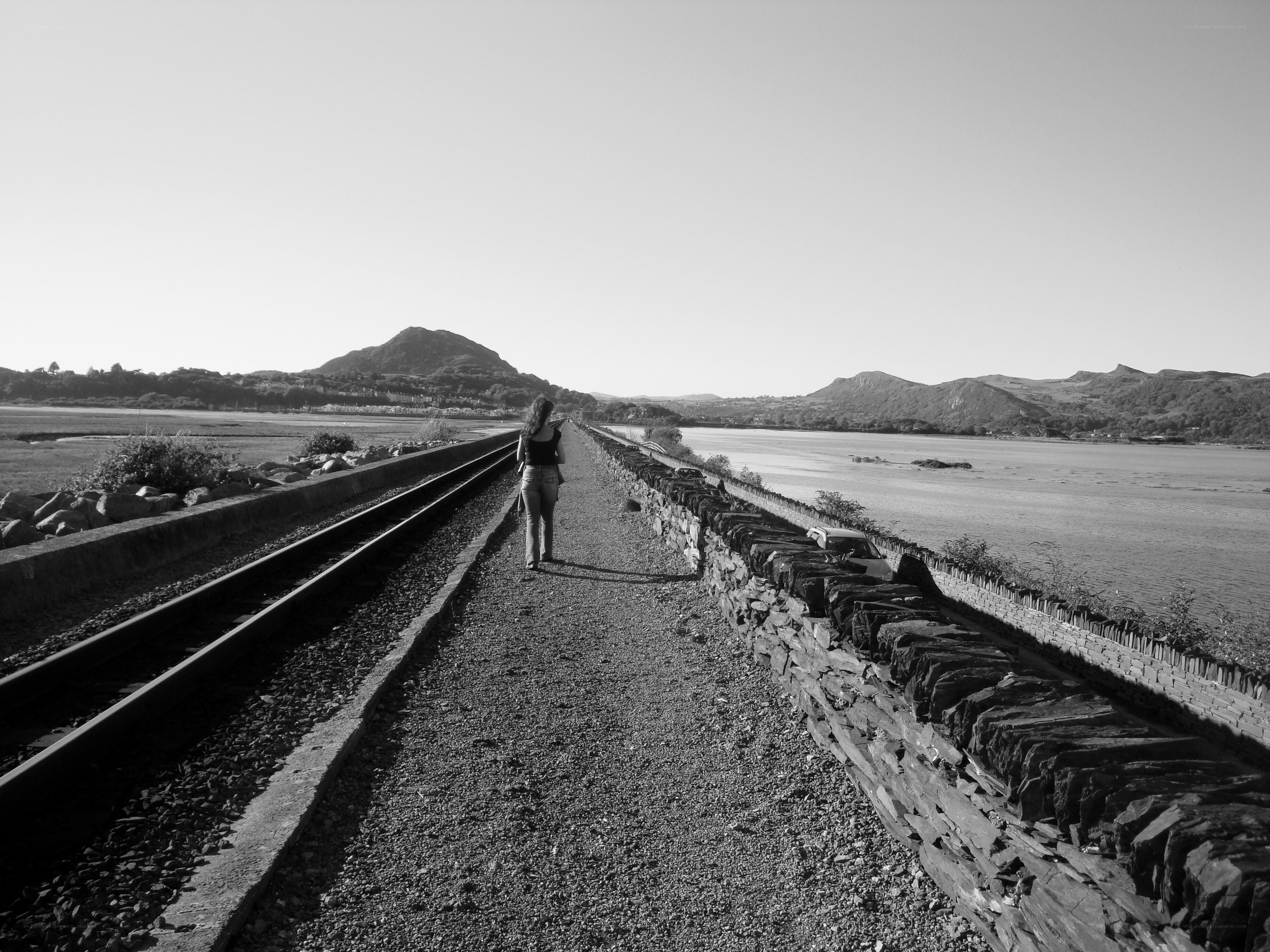 Person walking on railway bridge