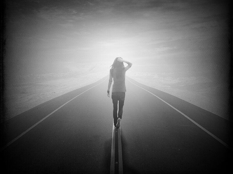 Person Walking on Road — Black