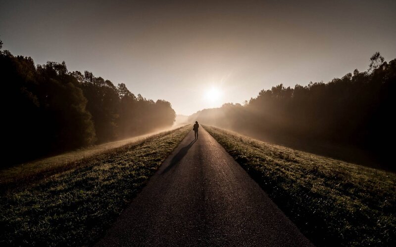 Person Walking on Road — Brown, Serene, Sunrise