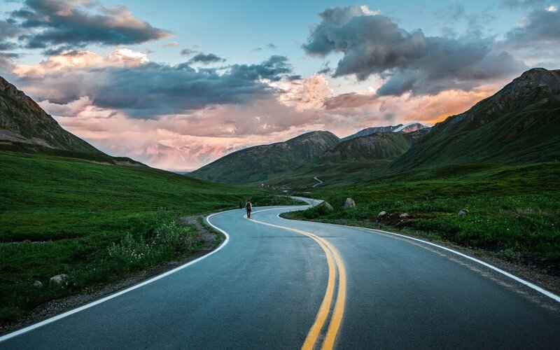 Person Walking on Road — Green, Dramatic