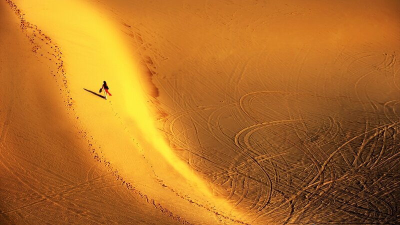Person Walking on Sand Dune — Yellow, Dramatic