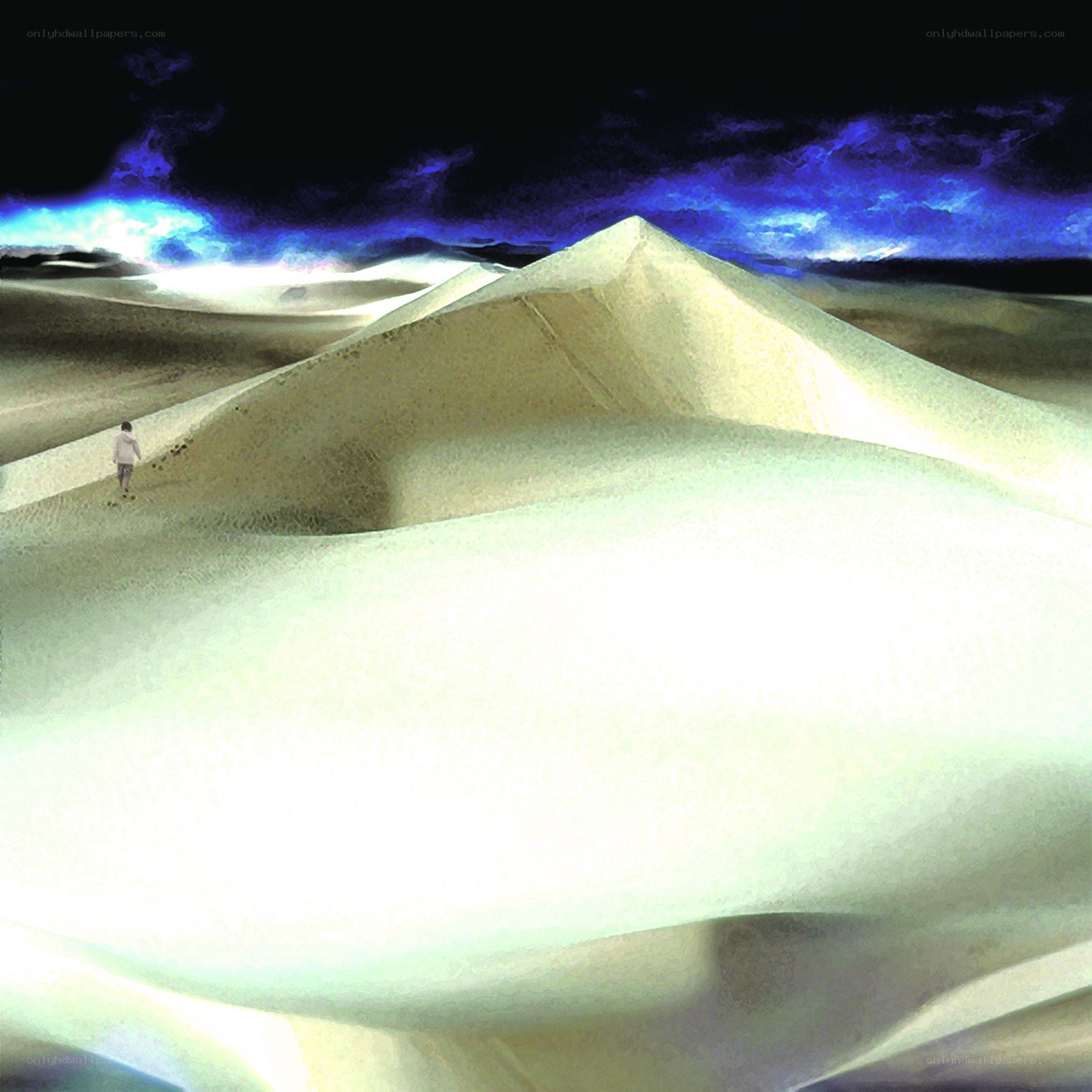 Person walking on sand dunes