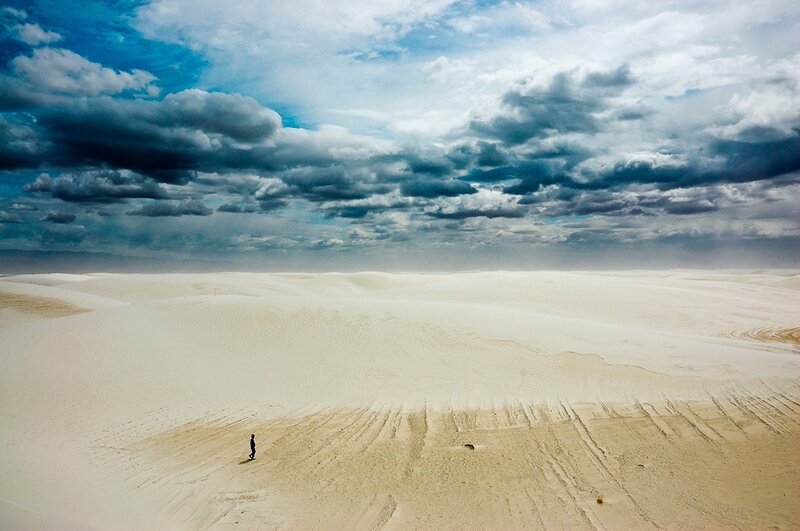 Person Walking on Sand Dunes — White