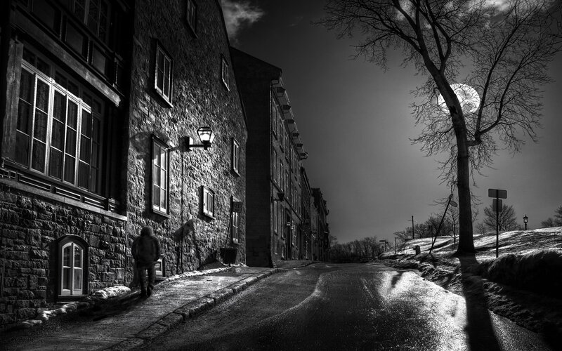 Person Walking on Sidewalk — Black, Dramatic