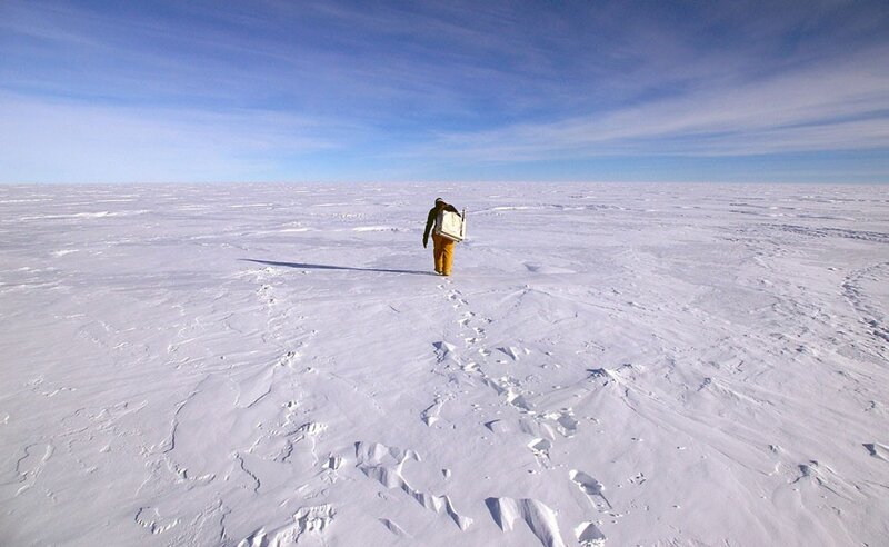 Person walking on snowy plain