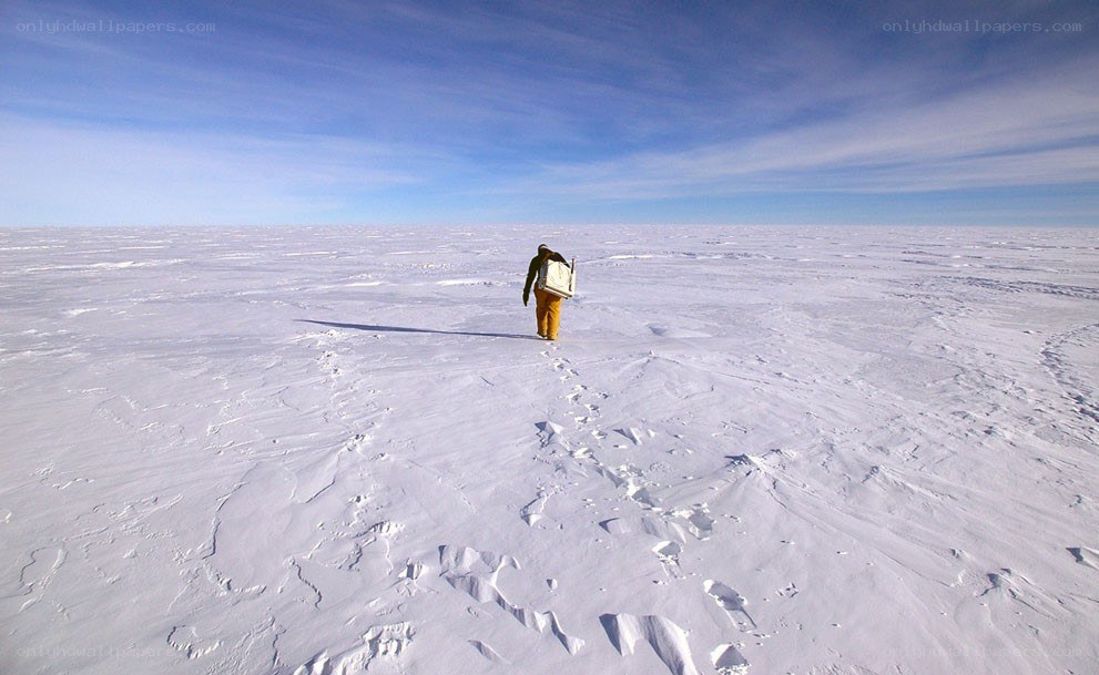 Person walking on snowy plain