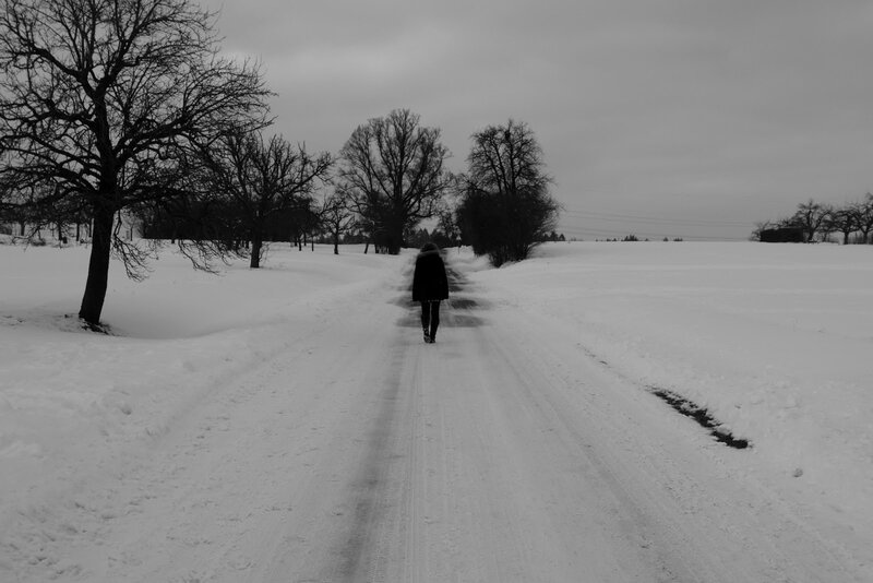 Person walking on snowy road