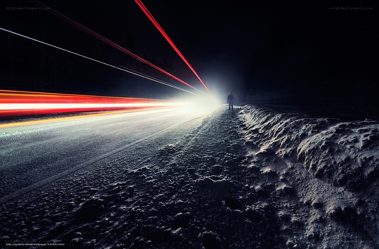 person walking on snowy road
