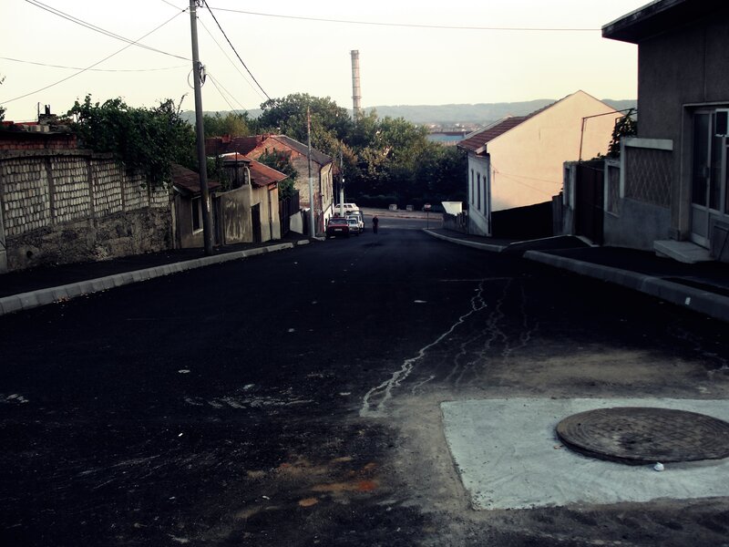 Person Walking on Street — Black