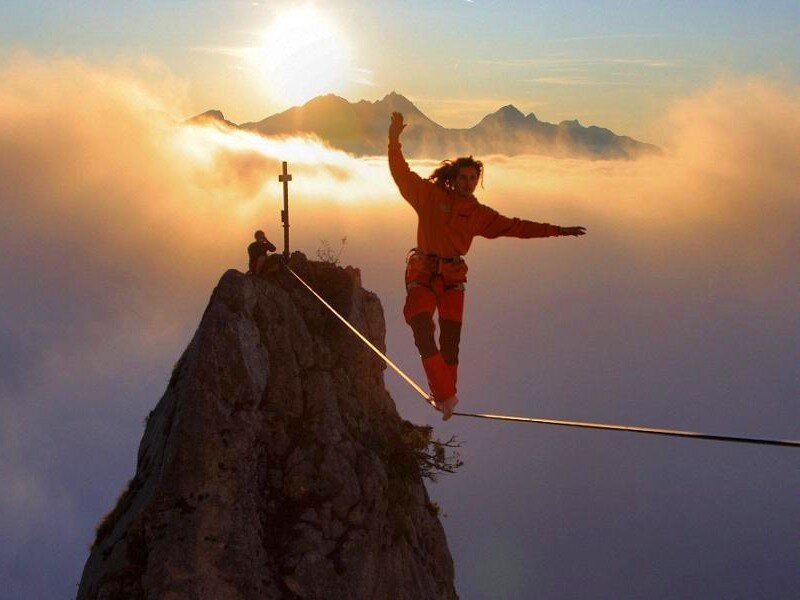 Person walking on tightrope