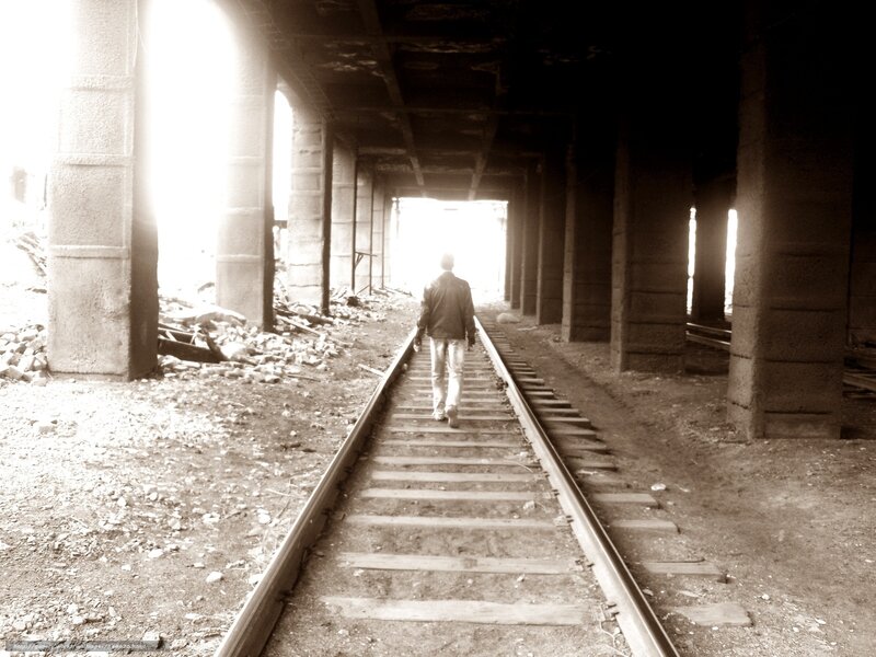 Person Walking on Tracks