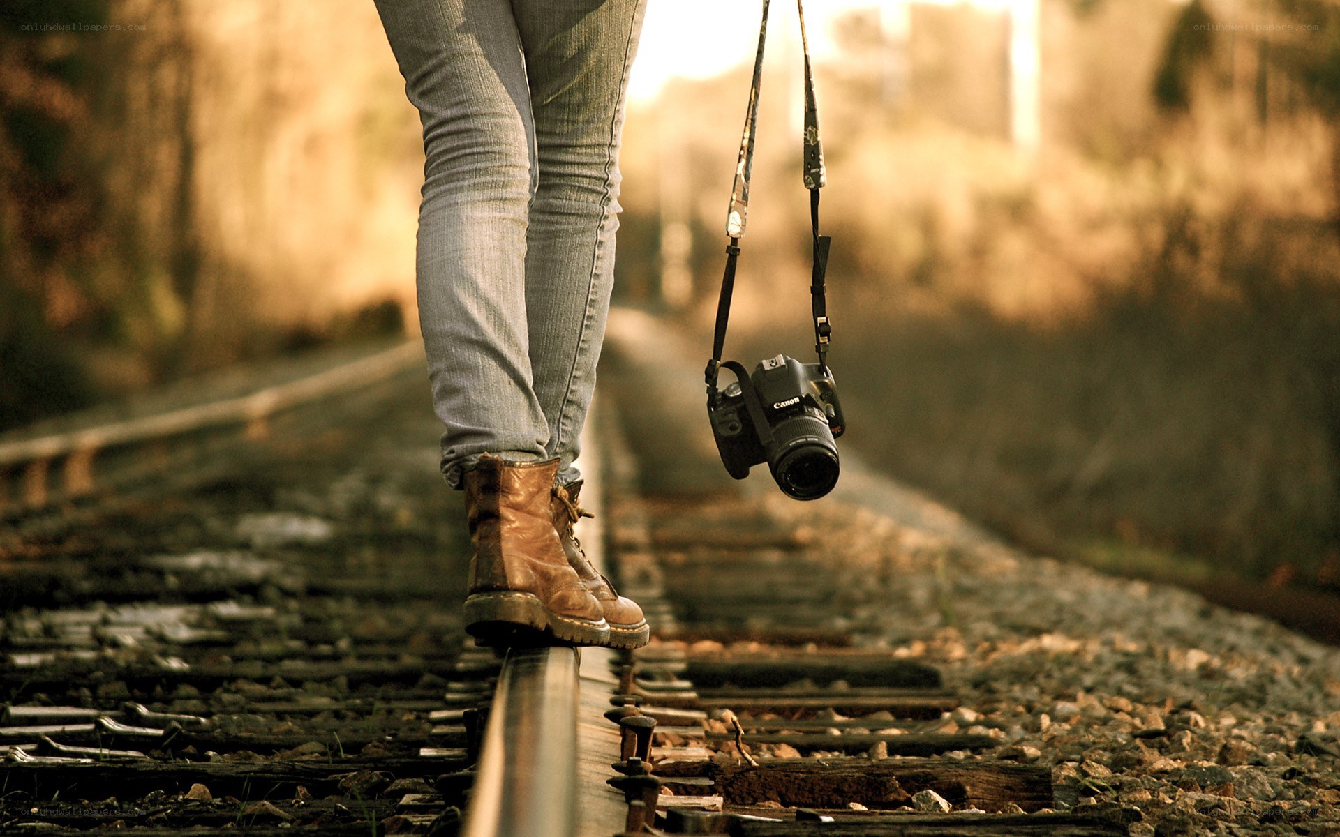 person walking on train tracks