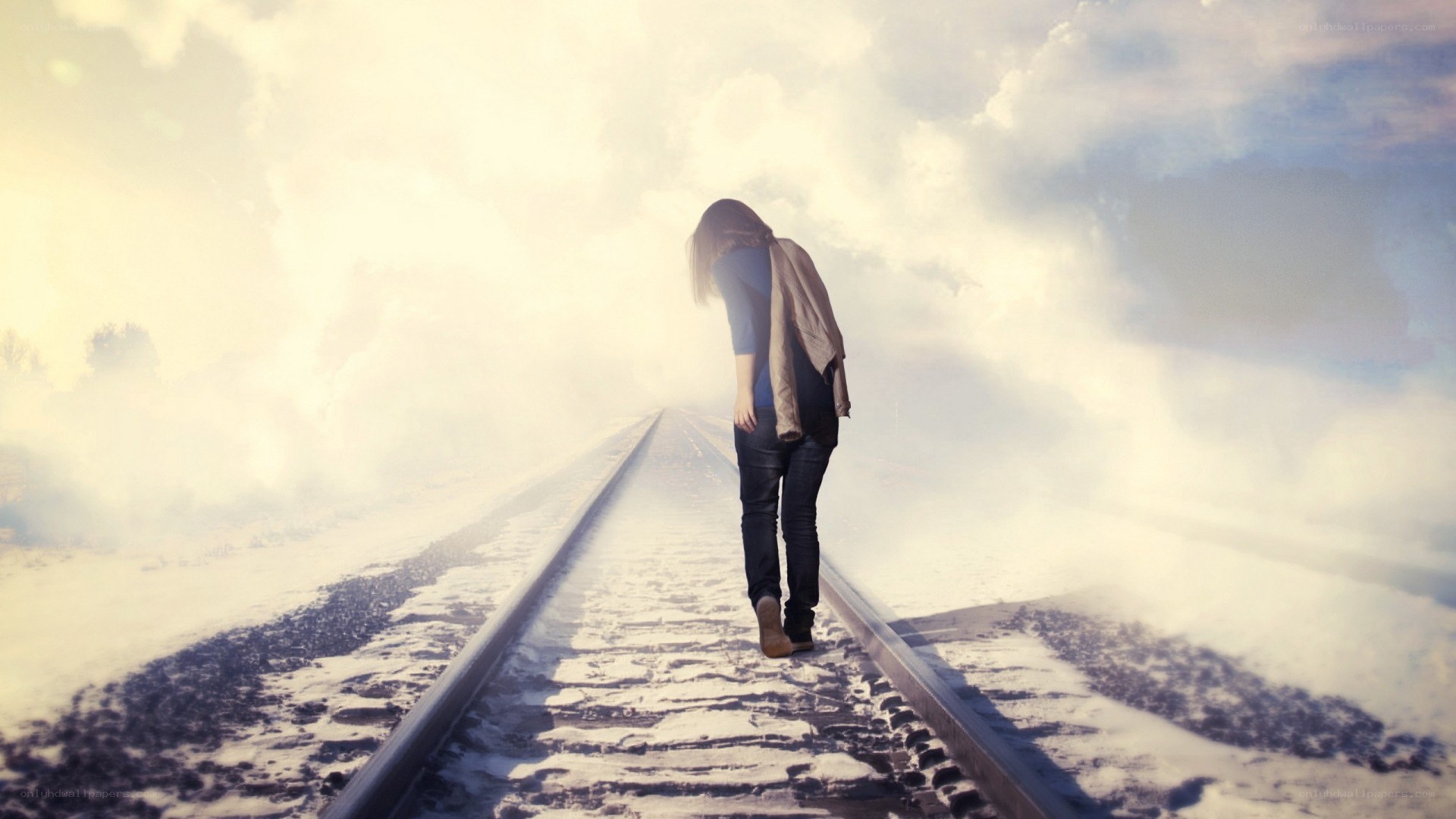 person walking on train tracks