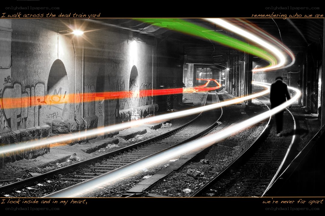 person walking on train tracks