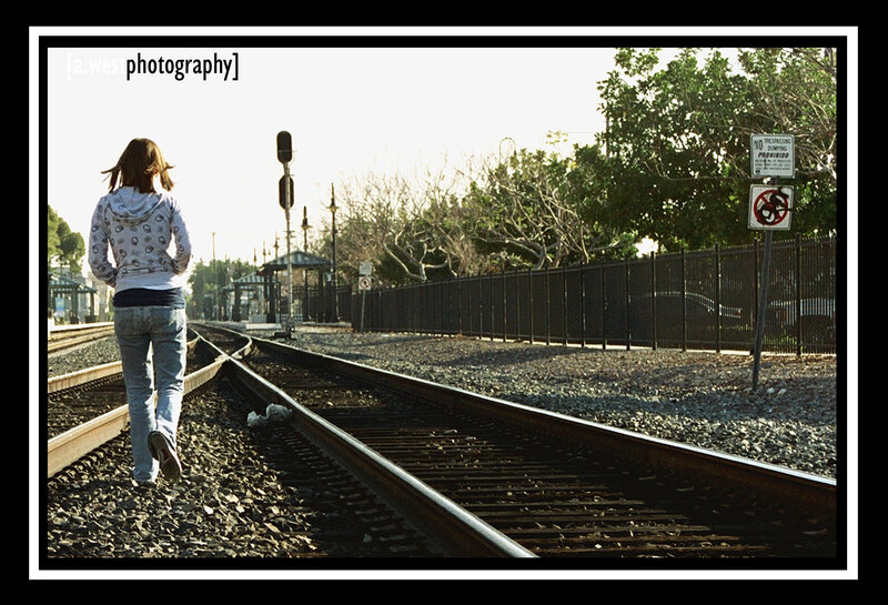 Person Walking on Train Tracks — Gray