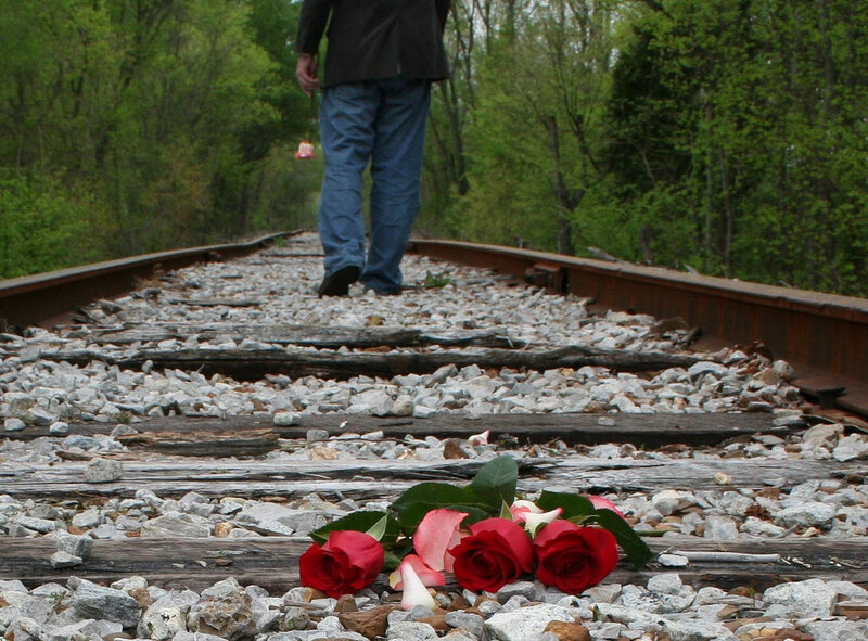 Person Walking on Train Tracks — Red