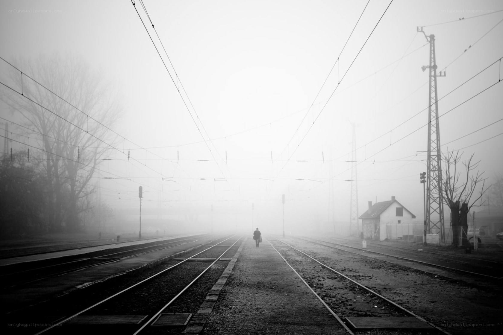 person walking on train tracks