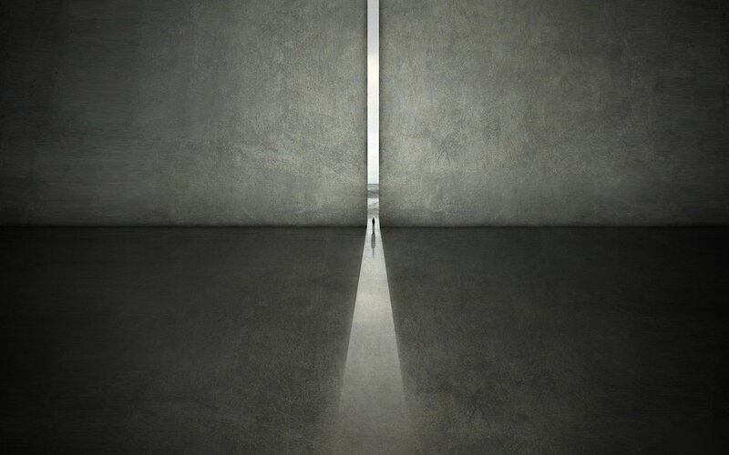 person walking through a narrow opening