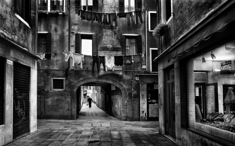 Person Walking Through Alley