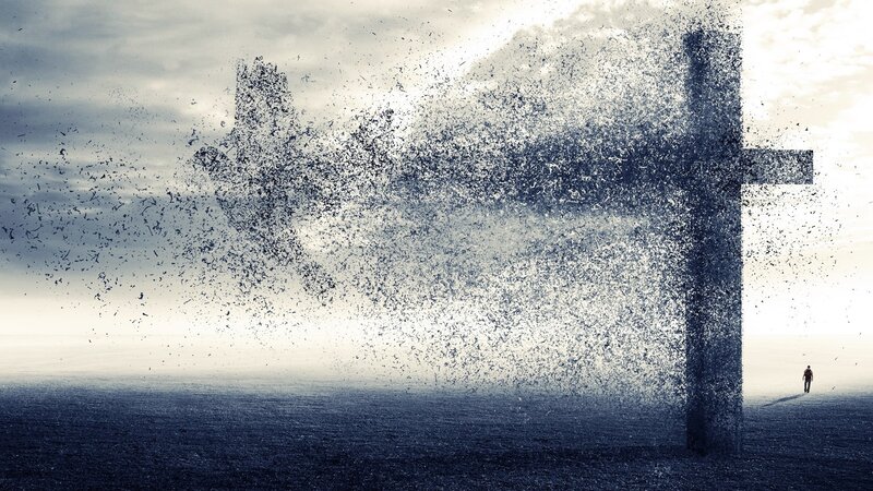 Person Walking Toward Cross — Gray, Dramatic