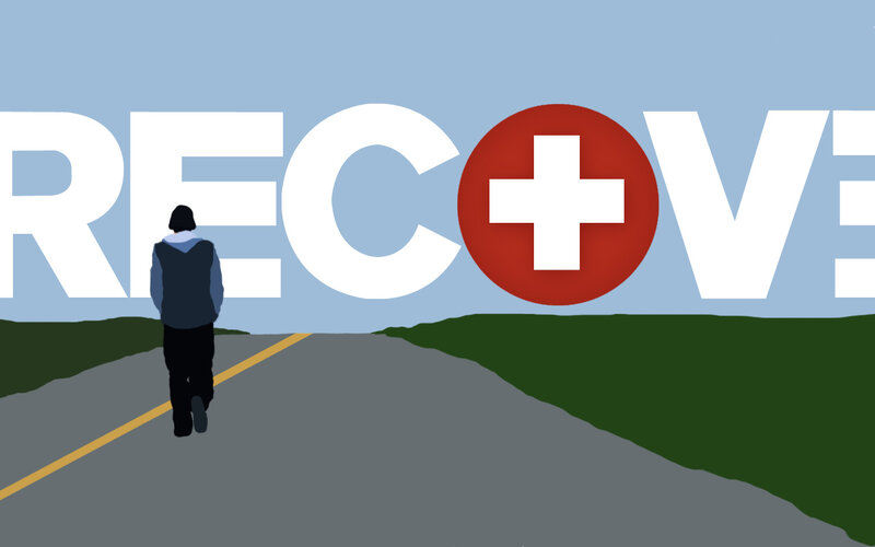 person walking toward recover sign