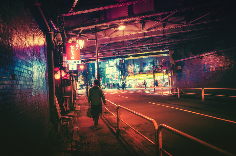 Person Walking under Bridge