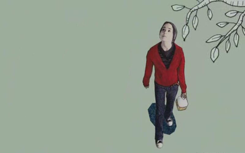 person walking under tree