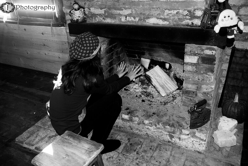 Person Warming Hands by Fire