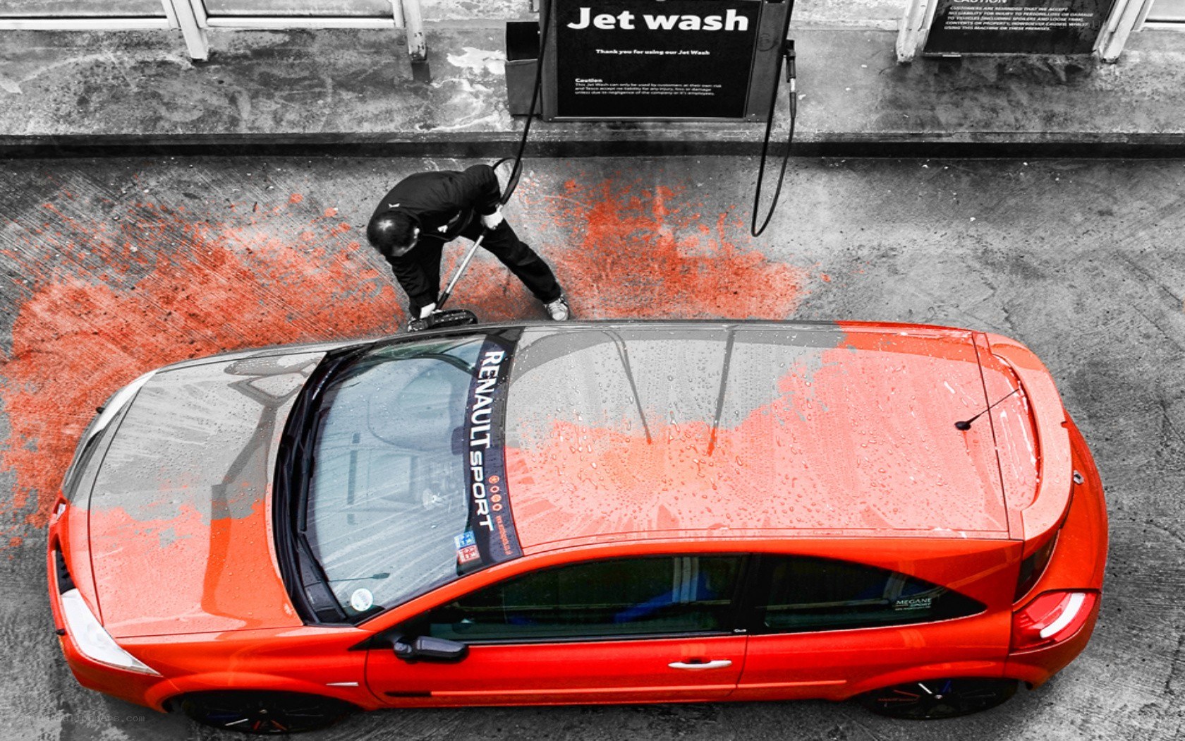 Person washing red car