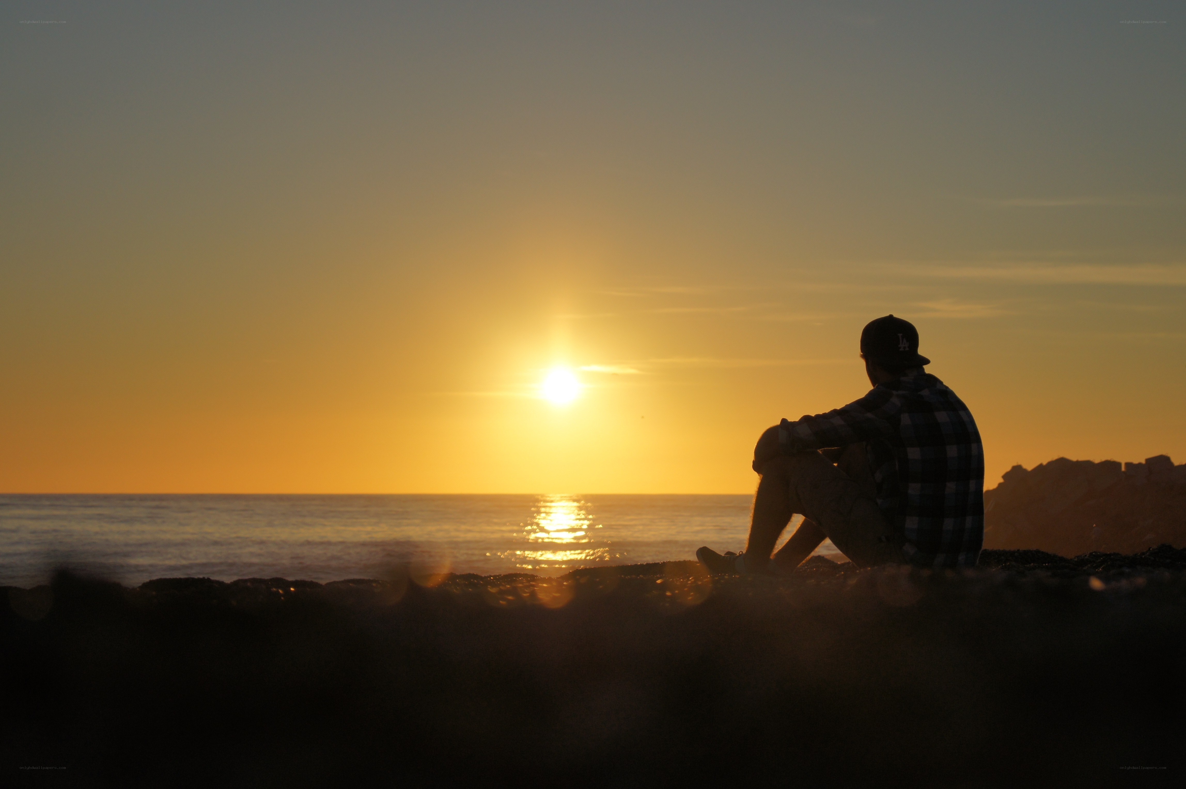 Person watching sunset at beach
