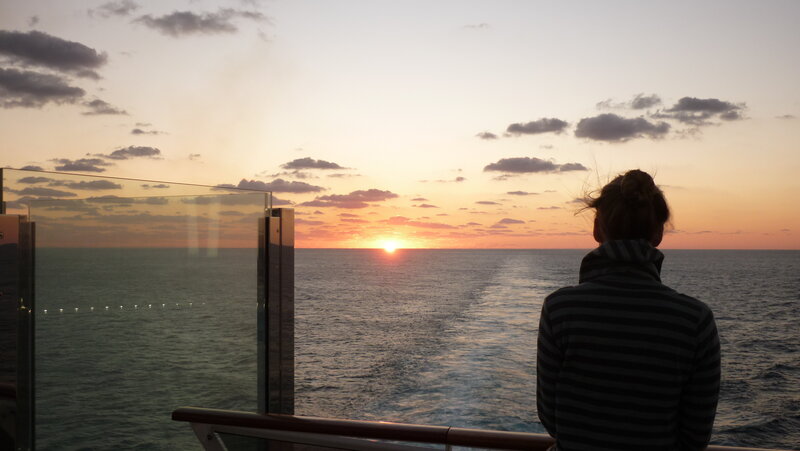 Person Watching Sunset — Orange, Serene, Photograph