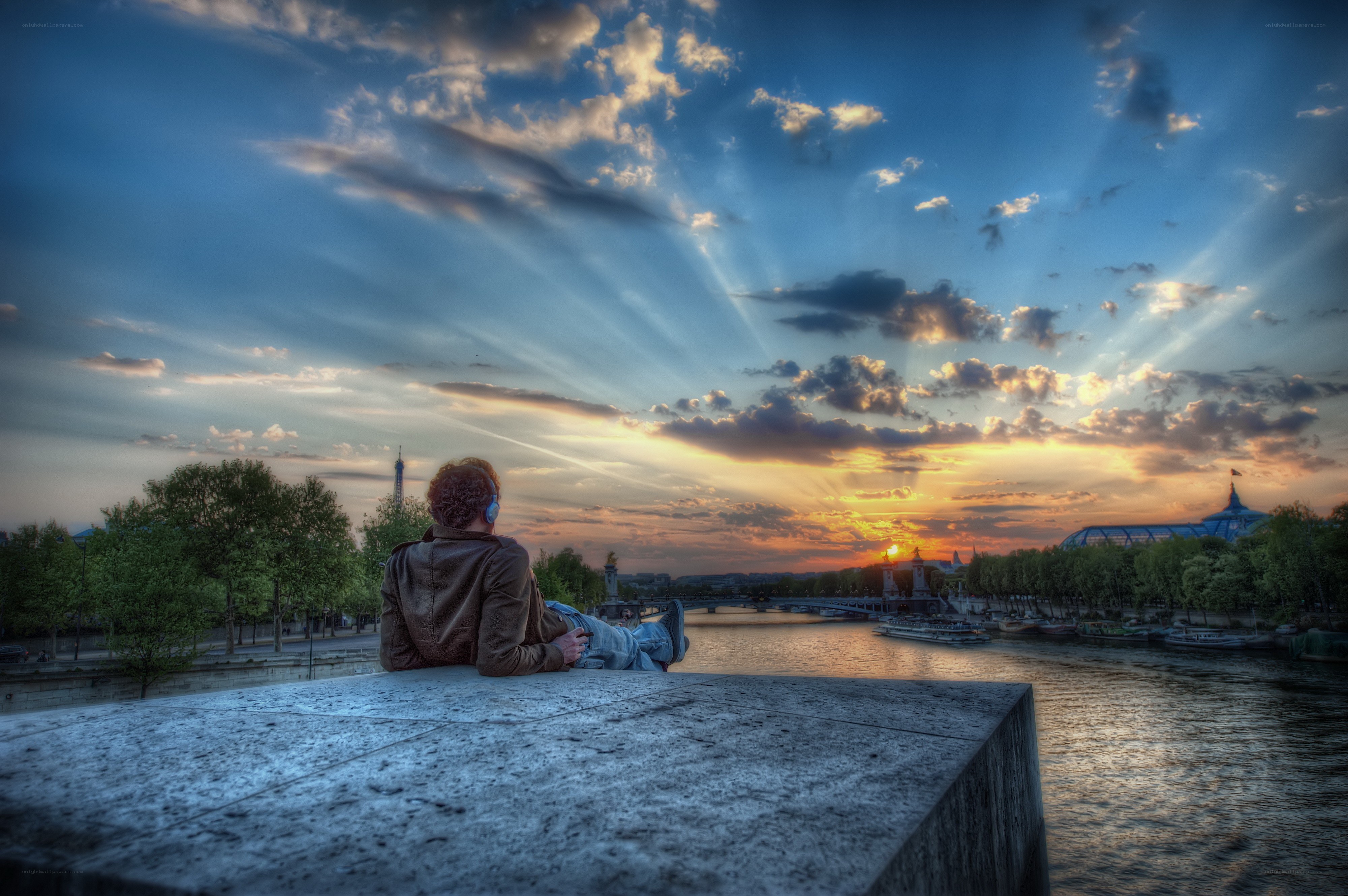 Person watching sunset over river
