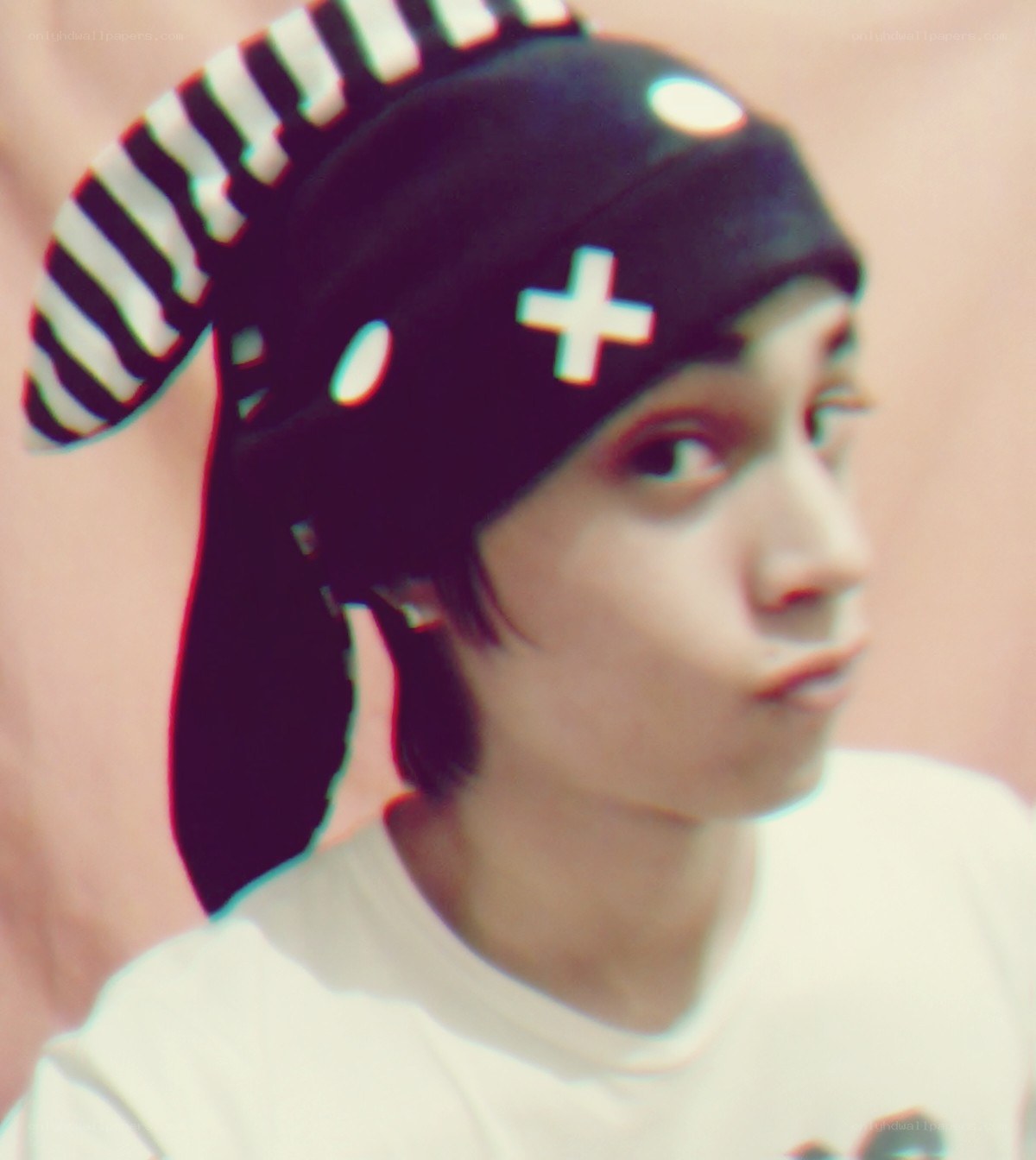 person wearing a striped hat