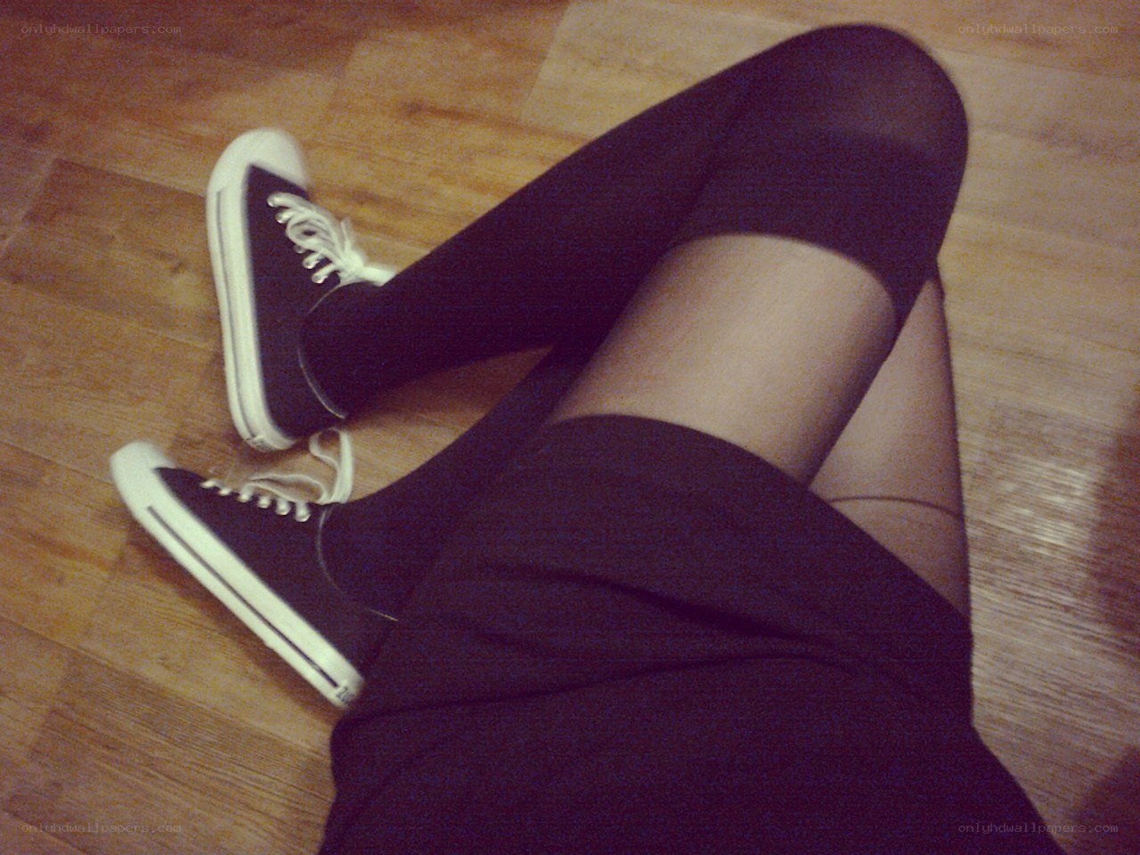 person wearing black sneakers