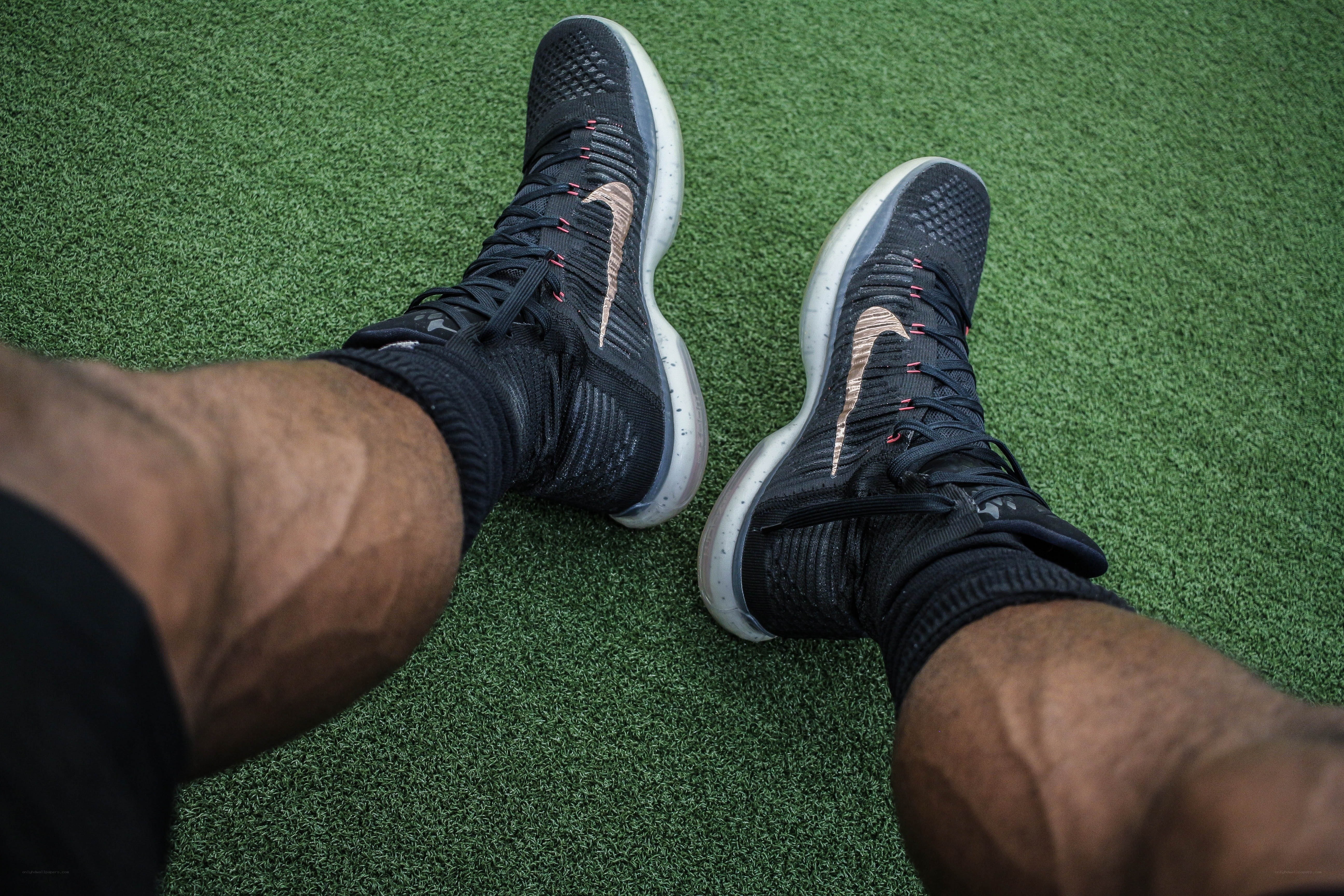 person wearing black sneakers