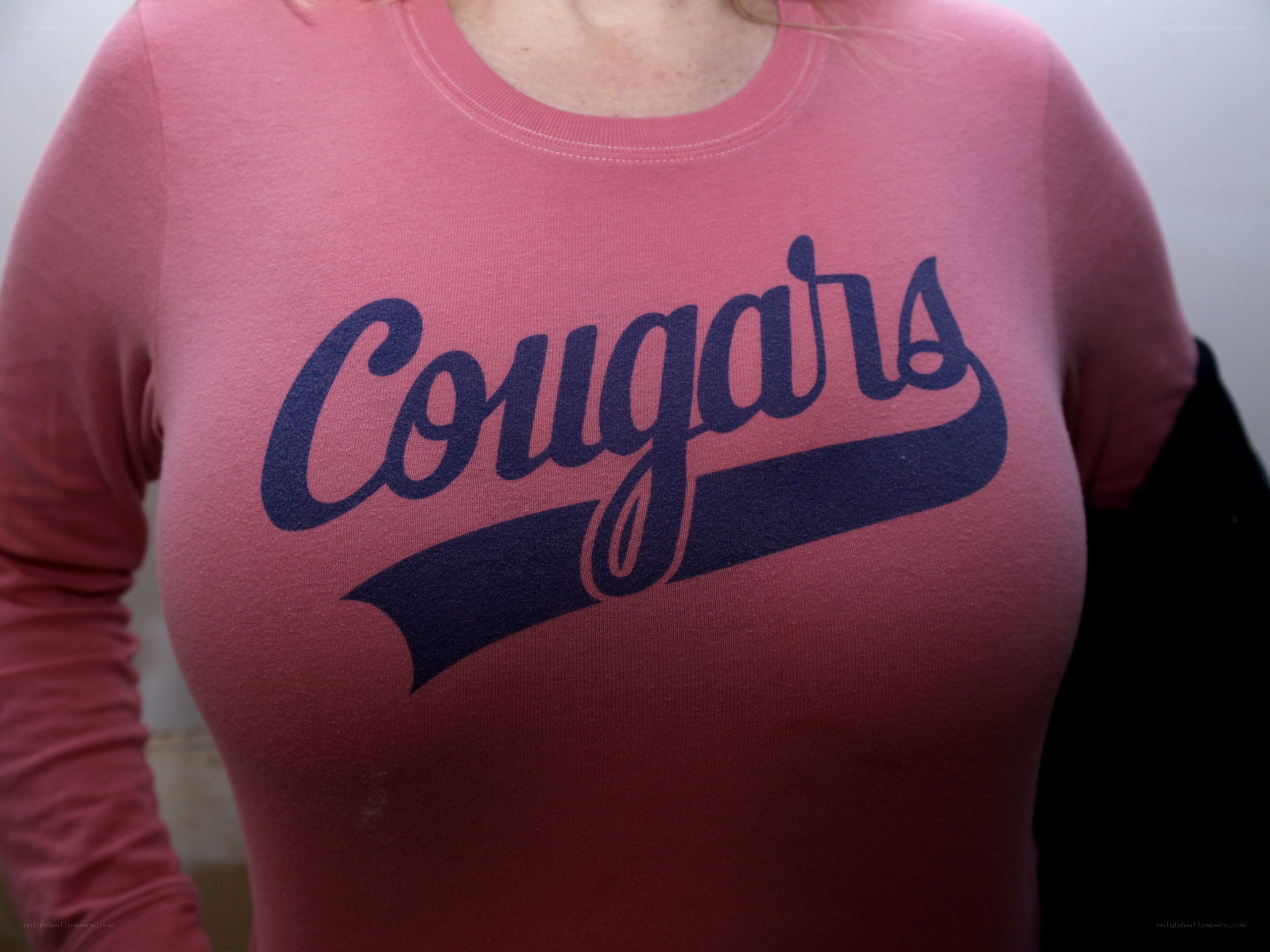 person wearing cougars shirt