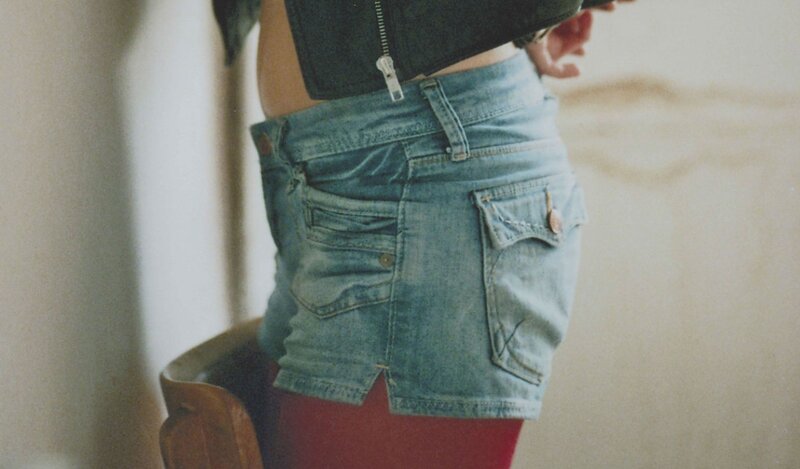 person wearing denim shorts