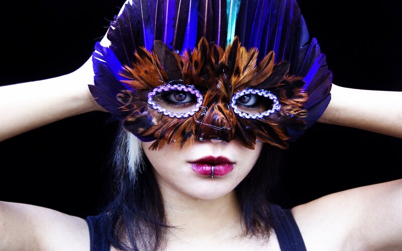 Person Wearing Feather Mask