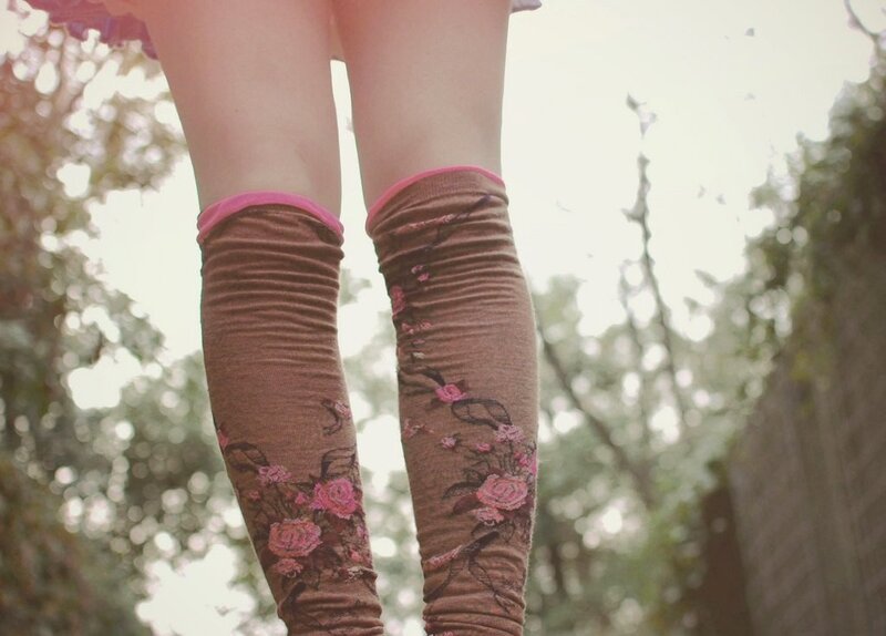 person wearing floral leg warmers