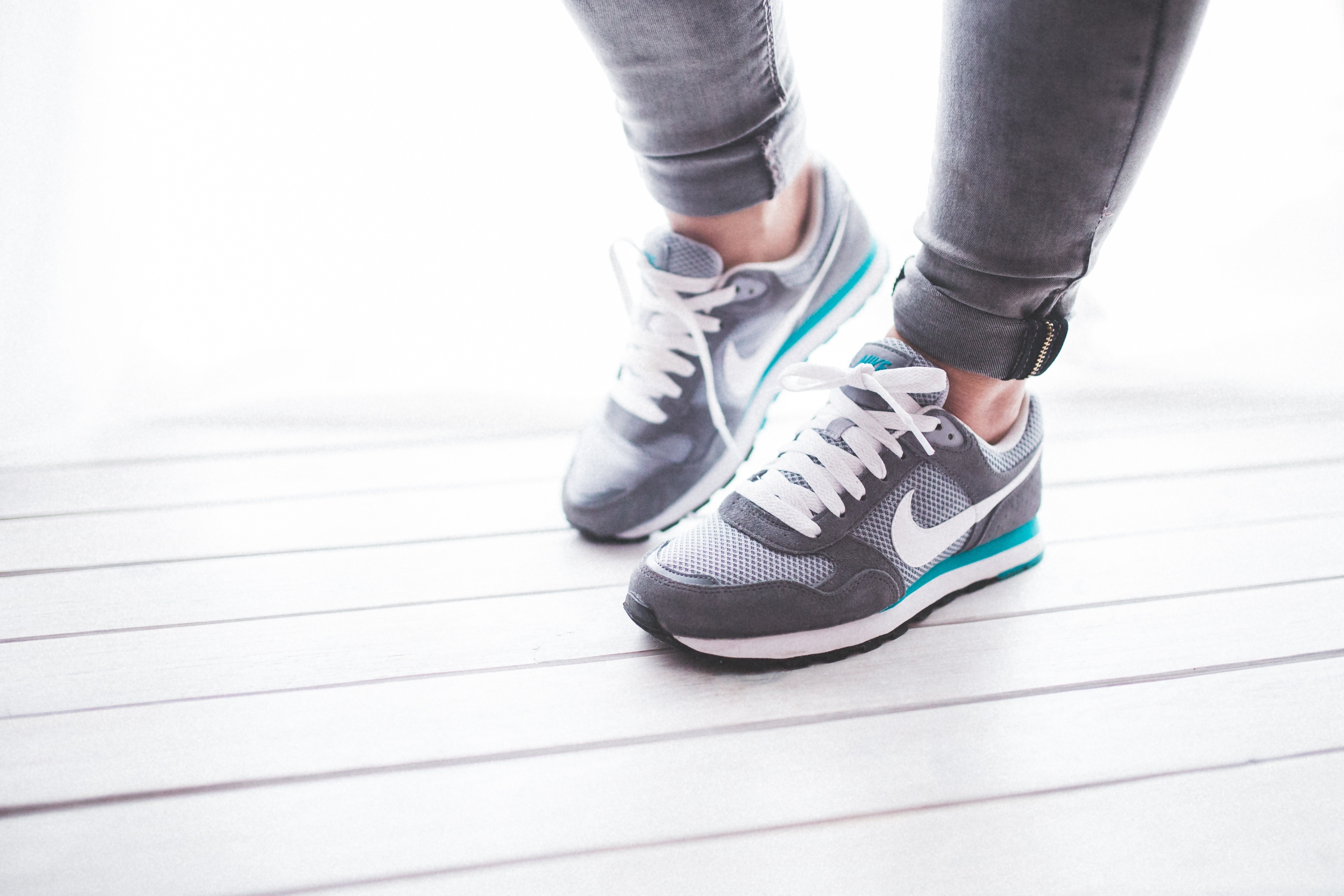 person wearing gray sneakers